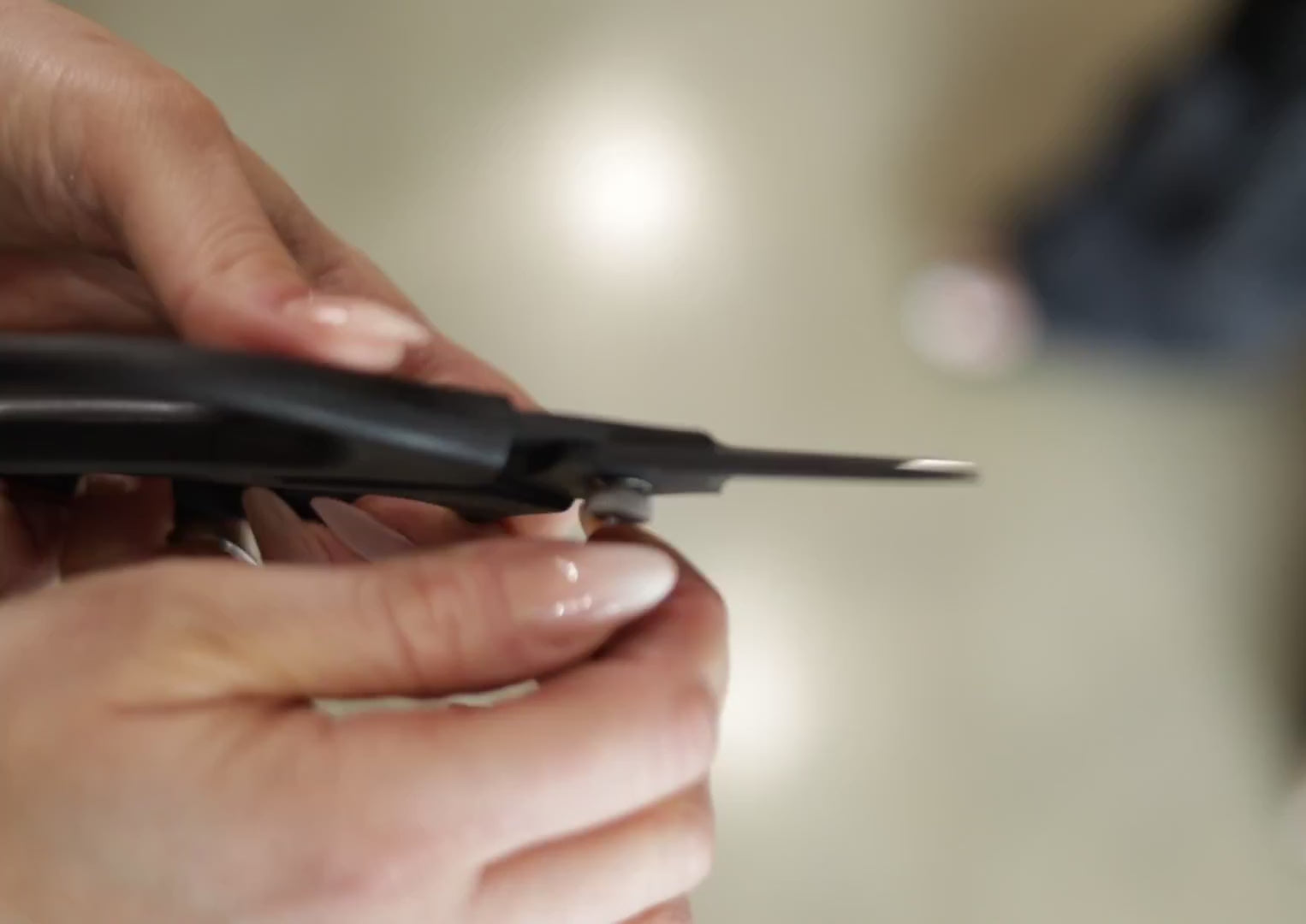 Load video: Twist the hand tighten tension nut, located on one side of the Precision Bond Snips. Tighten until desired tension is reached. Test by opening and closing the blades. Repeat as necessary or when you notice the blades getting lose.